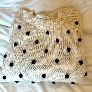 ASTR cream knit with black pom poms. Size small.